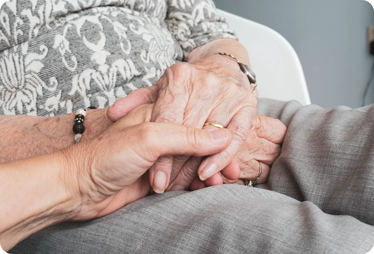 Several elderly people sat by the window
